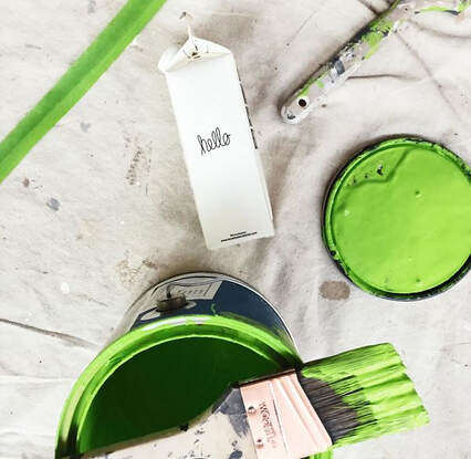 picture of paint cans and a brush